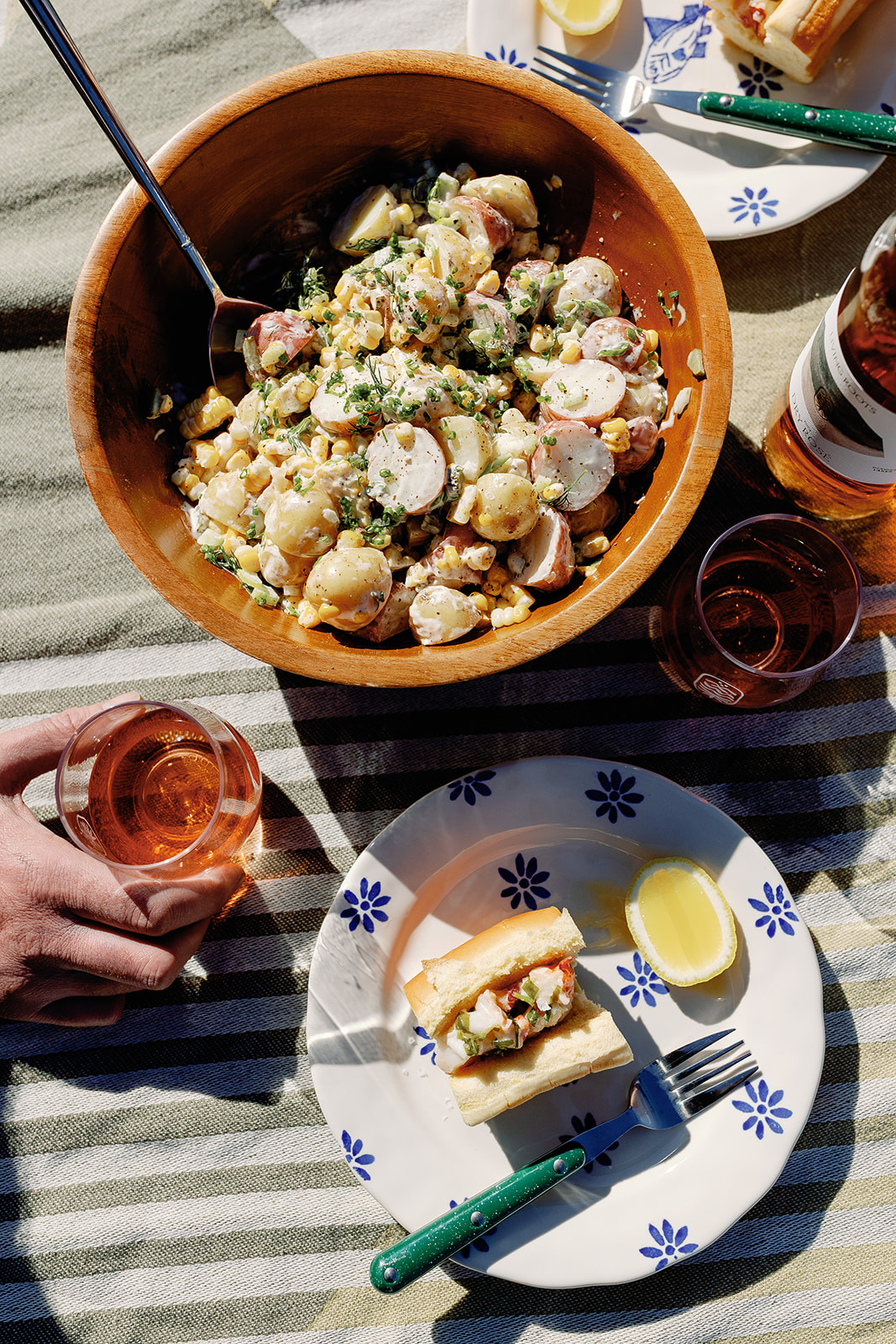Buttery tarragon lobster roll with creamy sweet corn potato salad