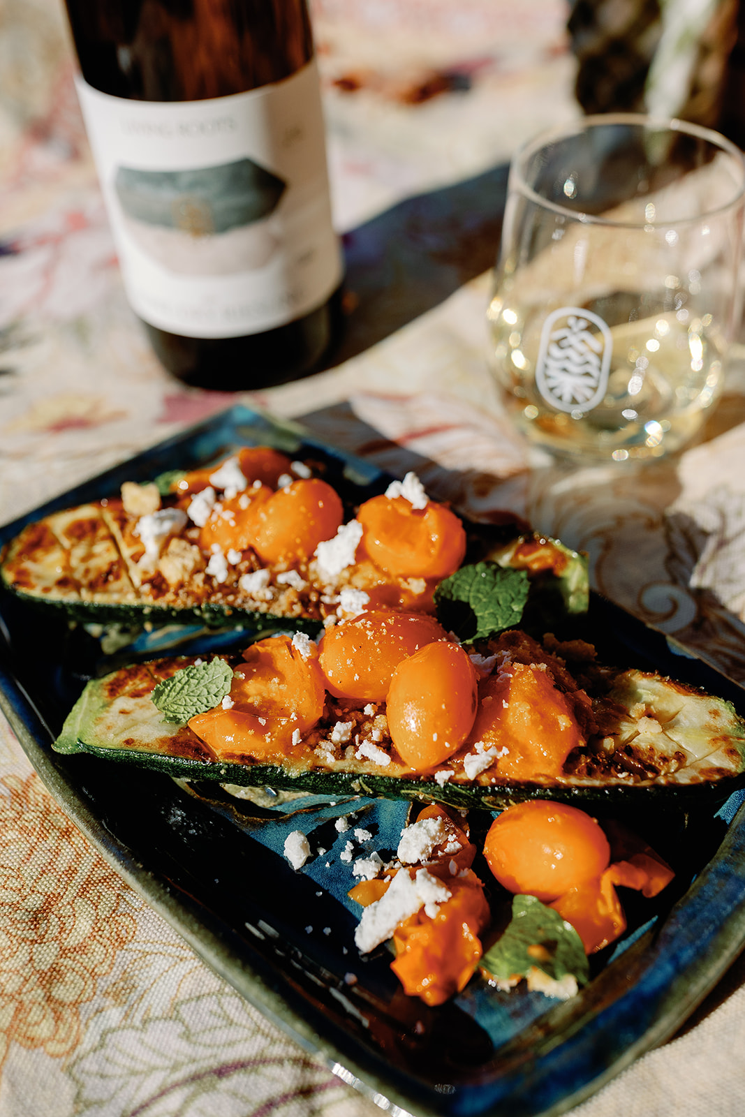 Charred zucchini + sungold tomato, ricotta salata, toasted breadcrumb, mint