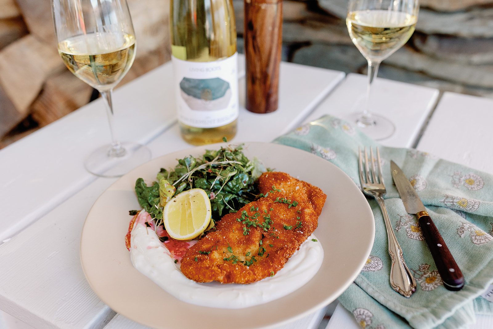 Chicken cutlets over lemony yogurt, spring greens tossed in chamomile-berry vinaigrette
